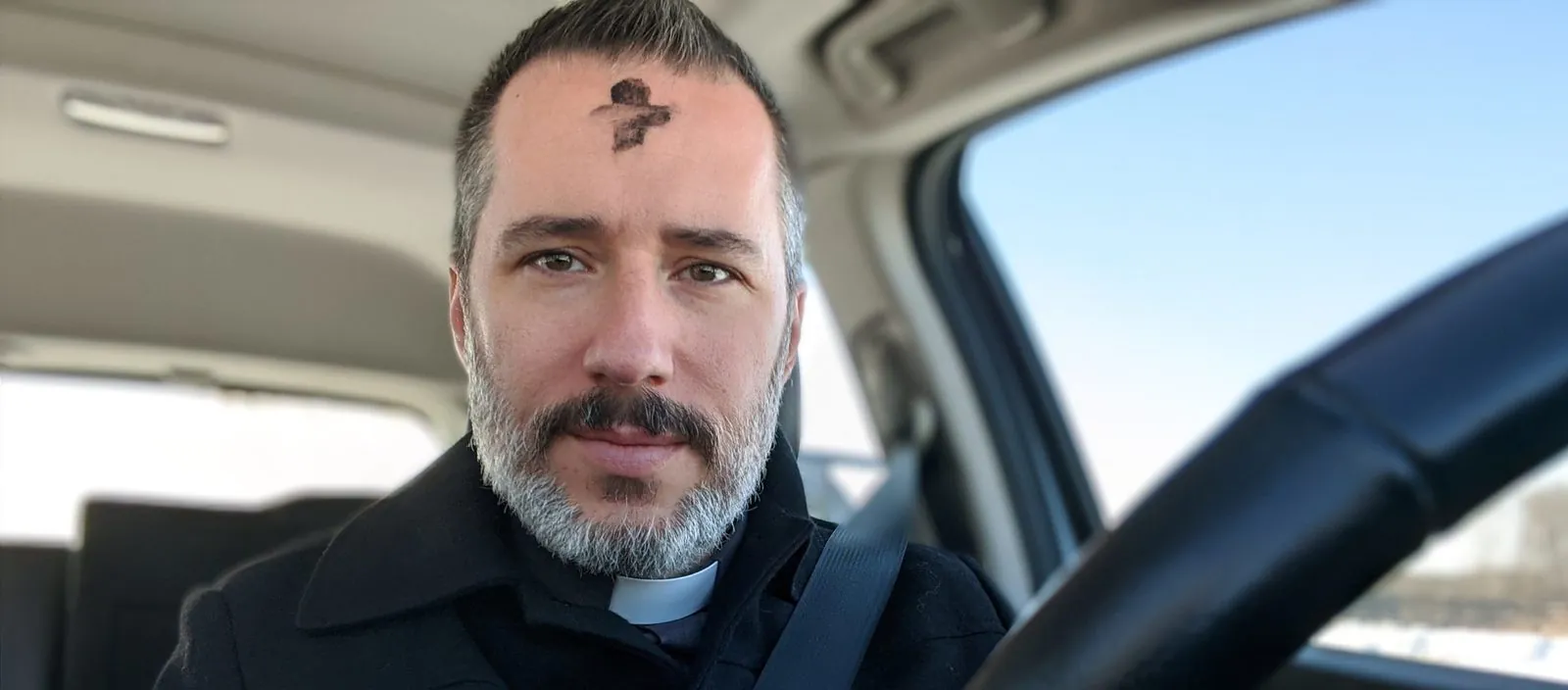 Deacon Ryan Sales with ashes on his forehead on Ash Wednesday