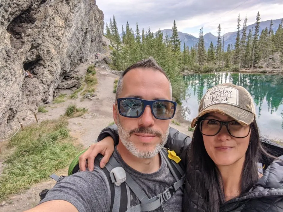 Deacon Ryan Sales and his wife hiking by a mountain lake