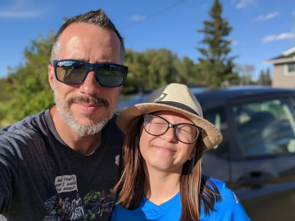 Deacon Ryan Sales with his daughter outdoors