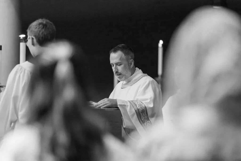 Deacon Ryan Sales at the altar during the Holy Thursday Mass